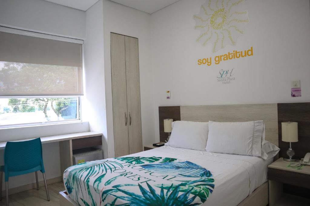 Postel nebo postele na pokoji v ubytování Hotel Sixtina Plaza Medellin