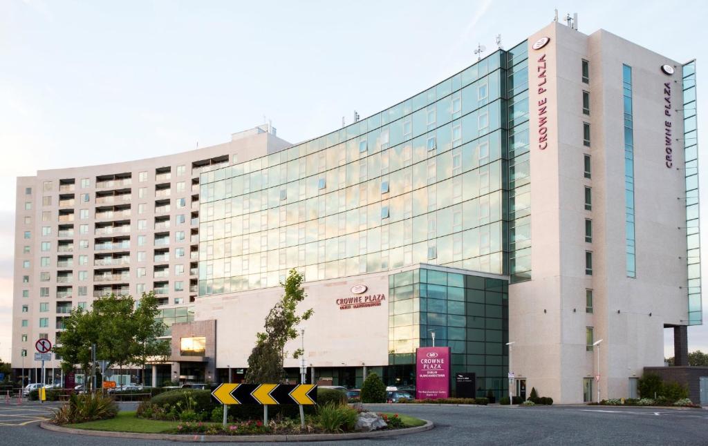 a large white building with a sign in front of it at Crowne Plaza Dublin Blanchardstown, an IHG Hotel in Blanchardstown