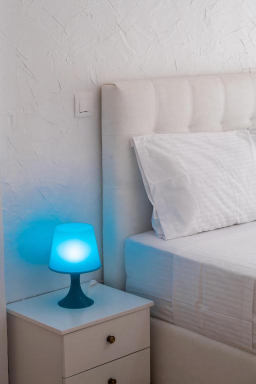 Łóżko lub łóżka w pokoju w obiekcie Seaview Rooms
