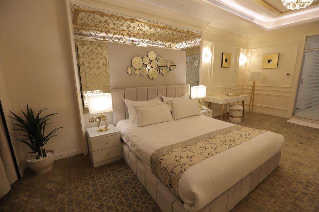 Postel nebo postele na pokoji v ubytování Broad Almkan Apart Hotel