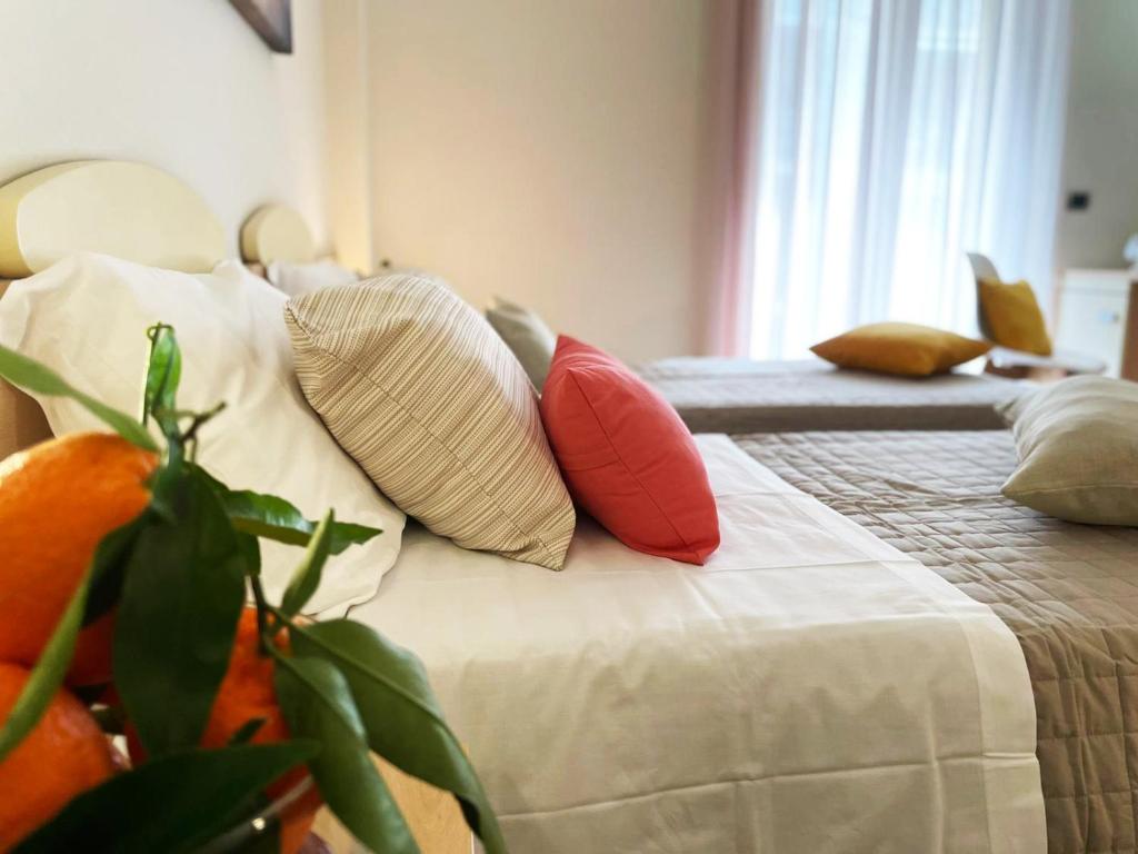 Postel nebo postele na pokoji v ubytování Avantgarde Hotel