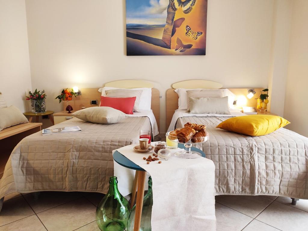 Postel nebo postele na pokoji v ubytování Avantgarde Hotel