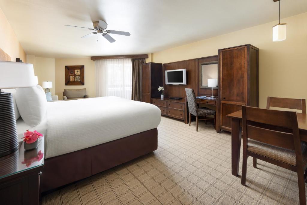 a hotel room with a large bed and a desk and a desk at Elevation Hotel & Spa in Crested Butte