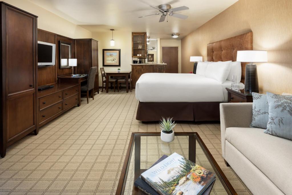 a hotel room with a bed and a couch at Elevation Hotel & Spa in Crested Butte