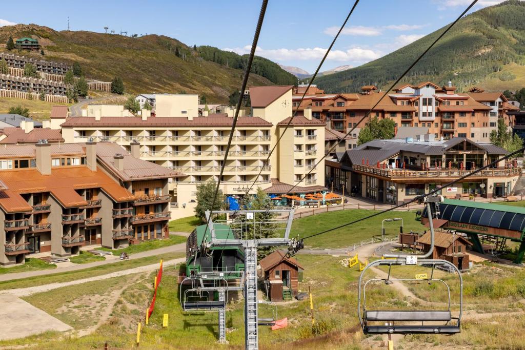 a gondola ride in a resort town with buildings at Elevation Hotel & Spa in Crested Butte
