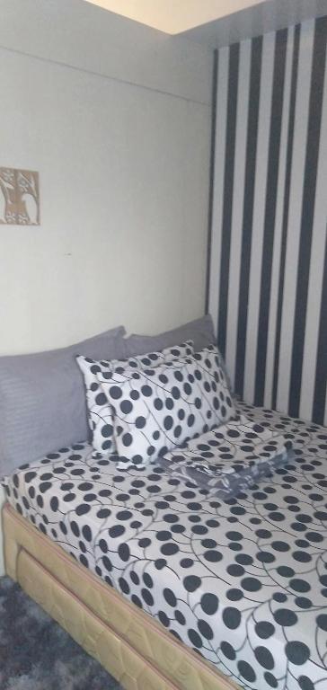 Postel nebo postele na pokoji v ubytování Yhanz Z Sea Residences