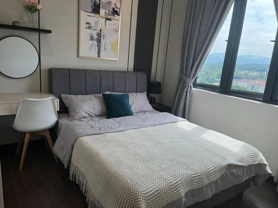 a bedroom with a bed and a large window at Attractive 3 Bedroom Condo with Pool-D Raudhah Homestay in Kajang