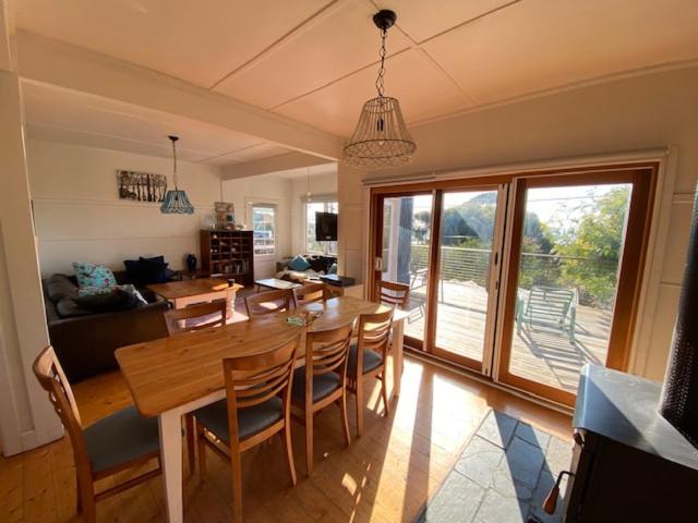 a dining room with a wooden table and chairs at Lorne Haven in Lorne