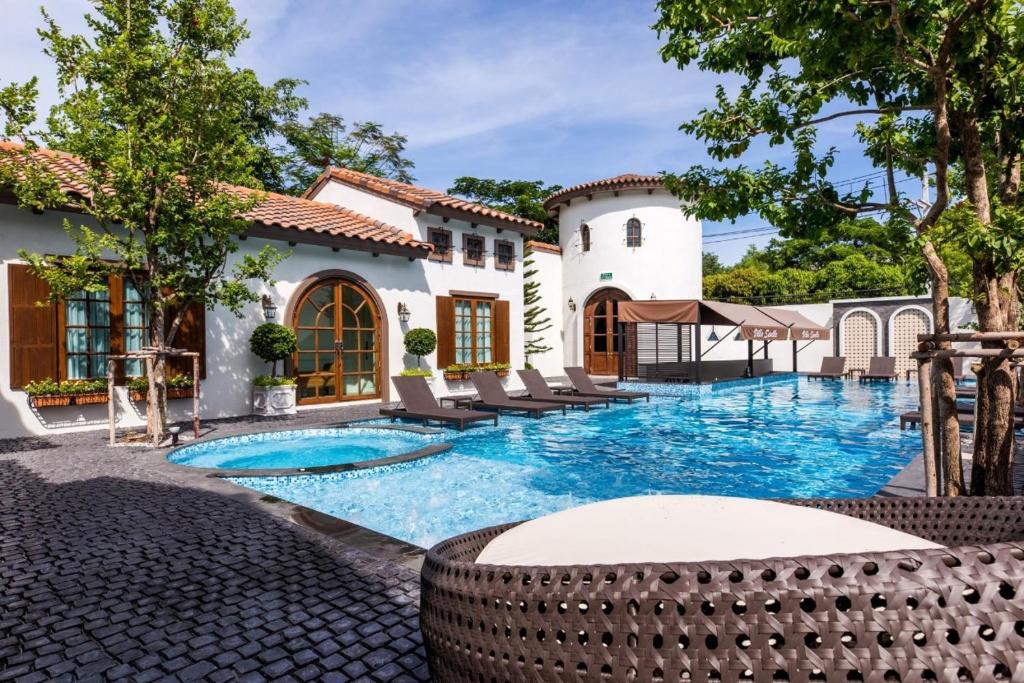 a swimming pool in the backyard of a house at Villa Seville in Hua Hin