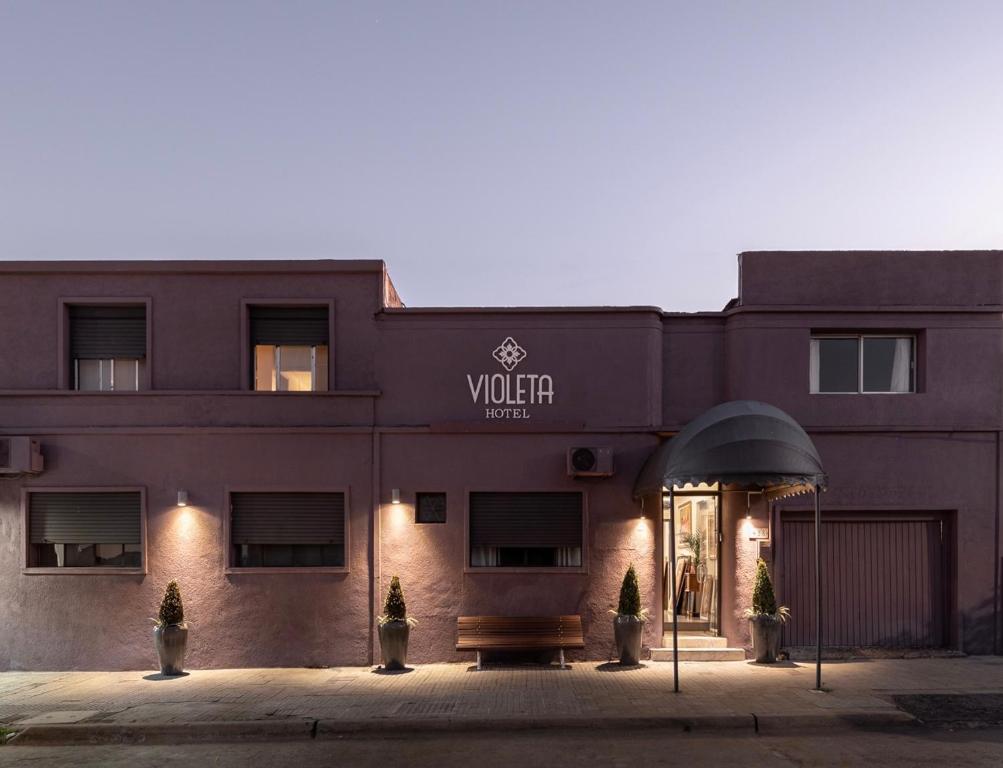 a building with a sign that reads vaughn hotel at VIOLETA HOTEL Boutique in Artigas