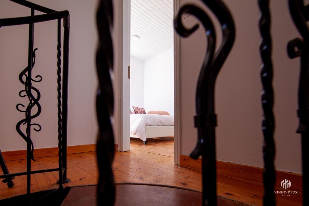 Postel nebo postele na pokoji v ubytování VINGT-DEUX Vouni 22