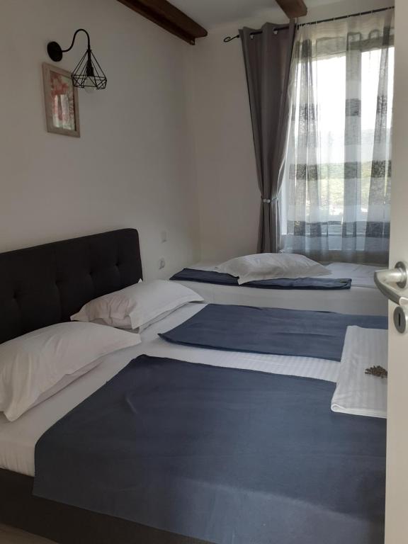 Postel nebo postele na pokoji v ubytování Agroturism Bori Punct Gastronomic Local