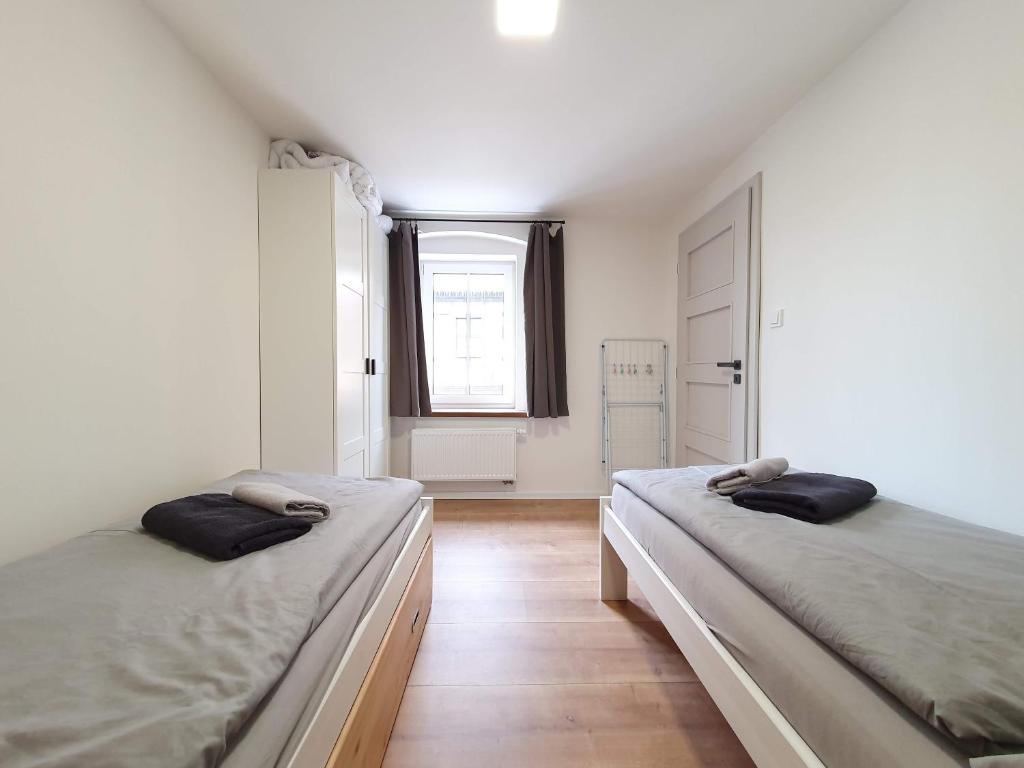 Postel nebo postele na pokoji v ubytování Apartmány U Muzea