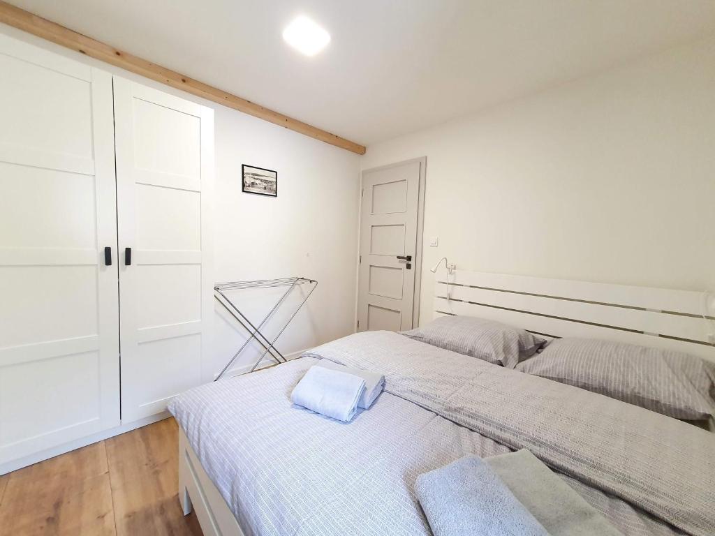 Postel nebo postele na pokoji v ubytování Apartmány U Muzea