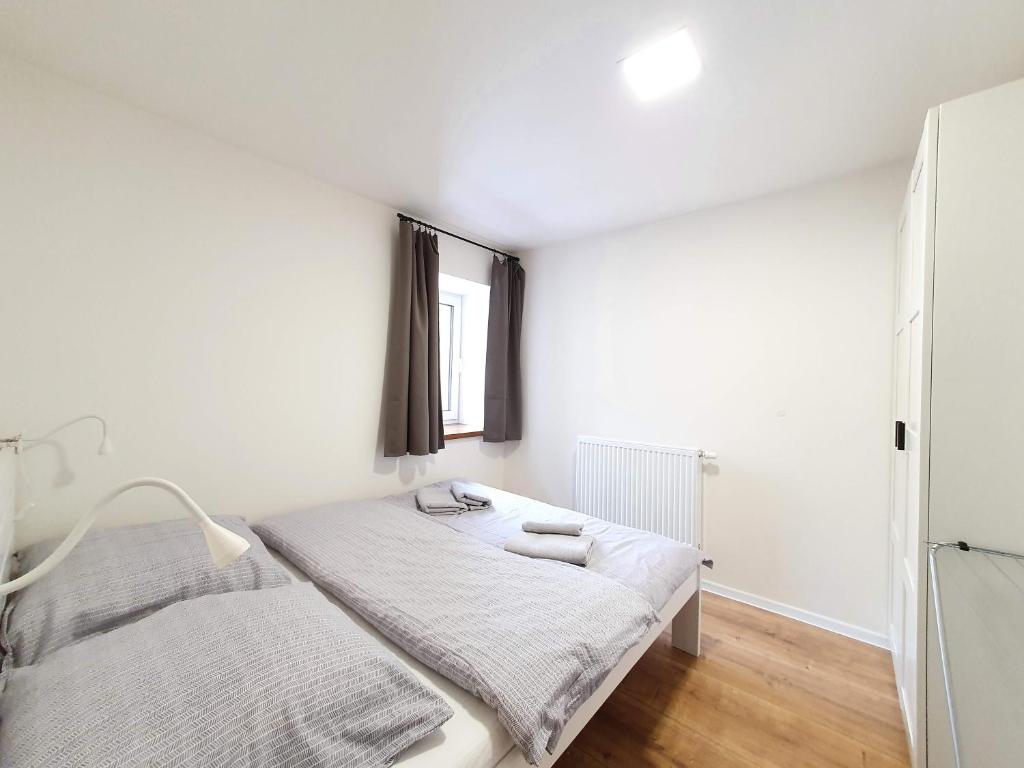 Postel nebo postele na pokoji v ubytování Apartmány U Muzea