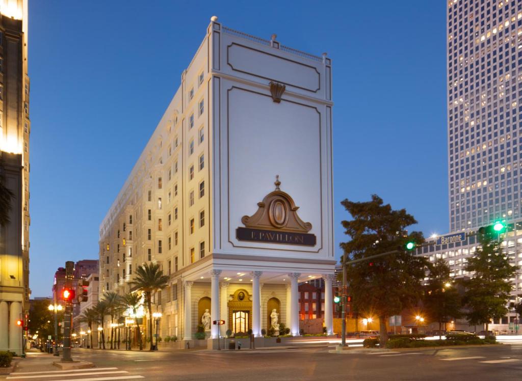 a large building with a clock on the side of it at Le Pavillon New Orleans in New Orleans