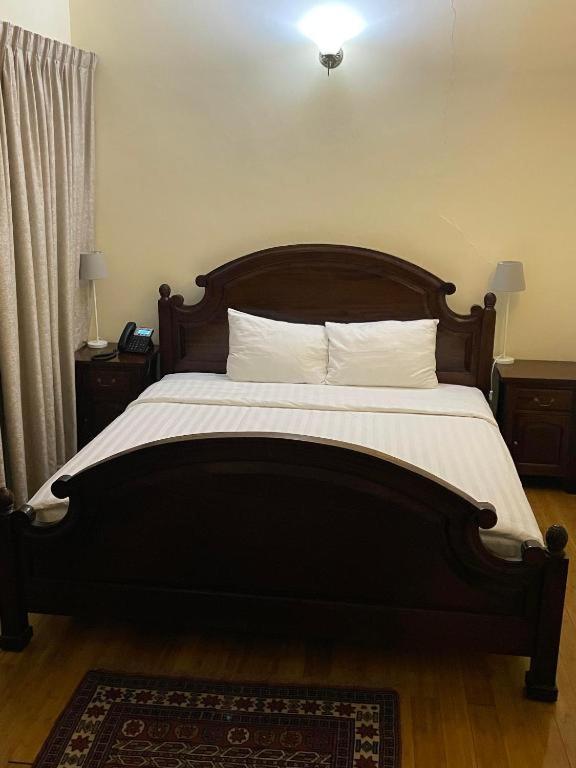 Katil atau katil-katil dalam bilik di Al Khariss Hotel