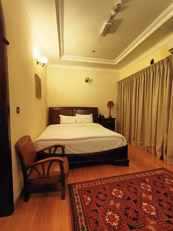 Katil atau katil-katil dalam bilik di Al Khariss Hotel