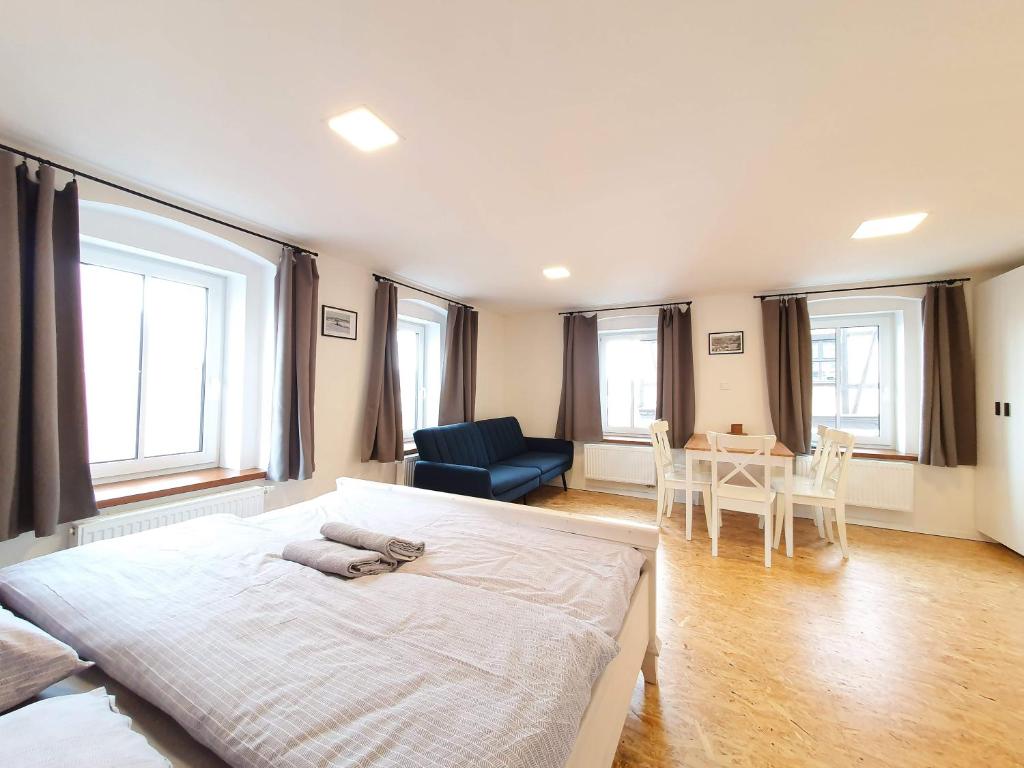 Postel nebo postele na pokoji v ubytování Apartmány U Muzea