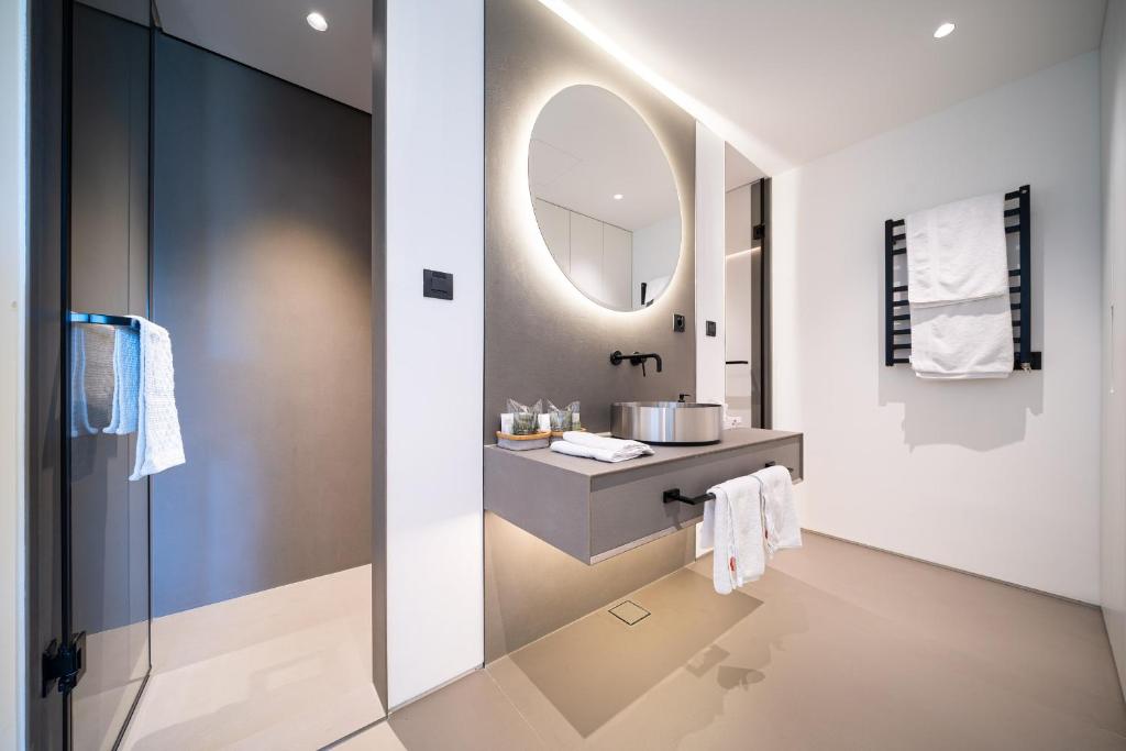 a bathroom with a sink and a mirror at Villa Lastva in Tivat