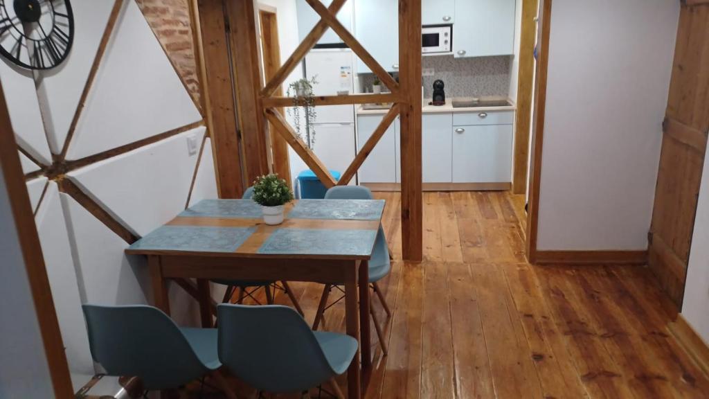 a kitchen and dining room with a table and chairs at Lisbon Rossio Typical Apartments in Lisbon