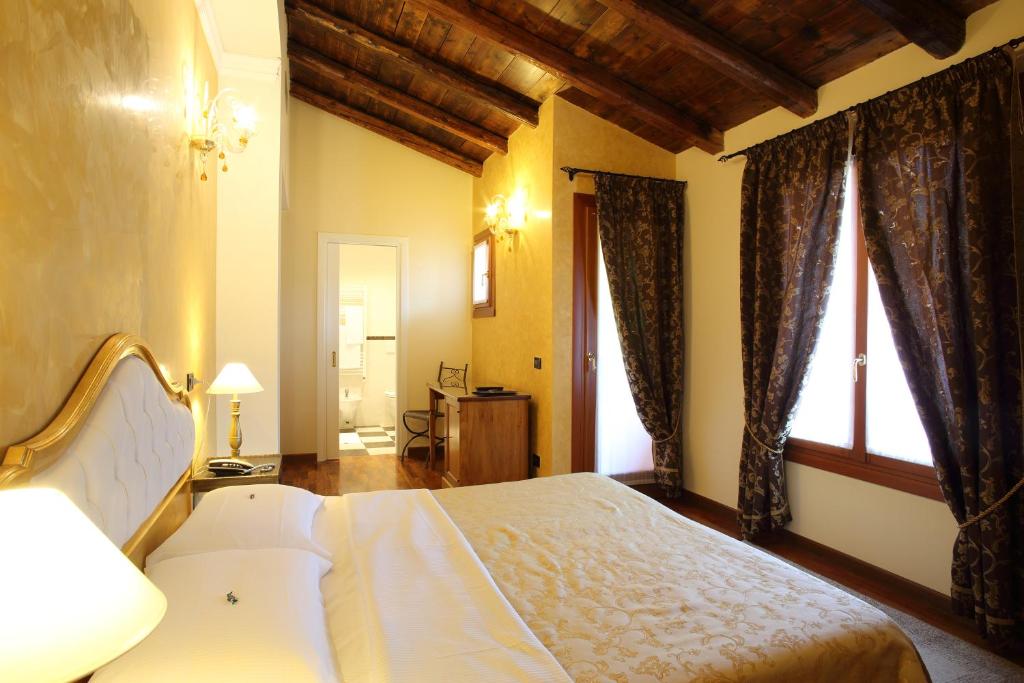 Postel nebo postele na pokoji v ubytování Isola Di Caprera