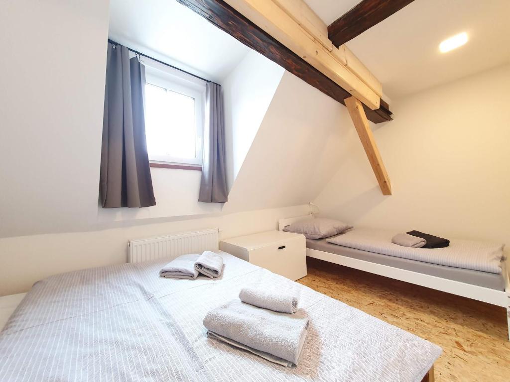 Postel nebo postele na pokoji v ubytování Apartmány U Muzea