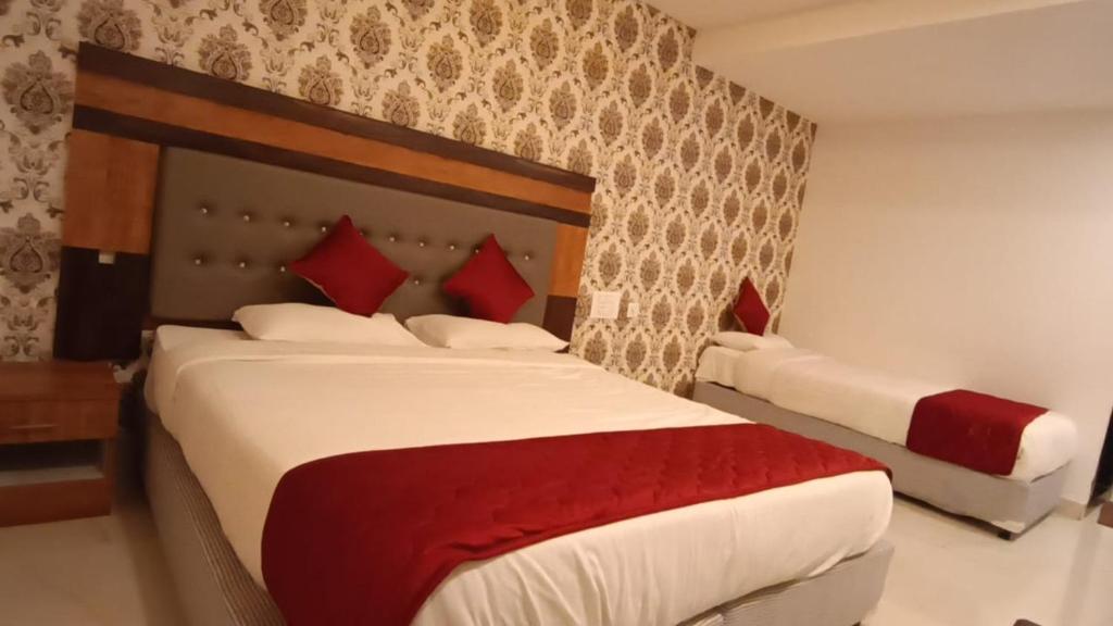Postel nebo postele na pokoji v ubytování Hotel Woodside Prestige