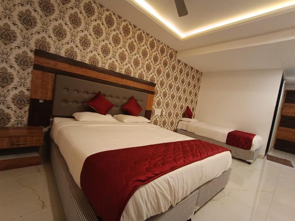 Postel nebo postele na pokoji v ubytování Hotel Woodside Prestige