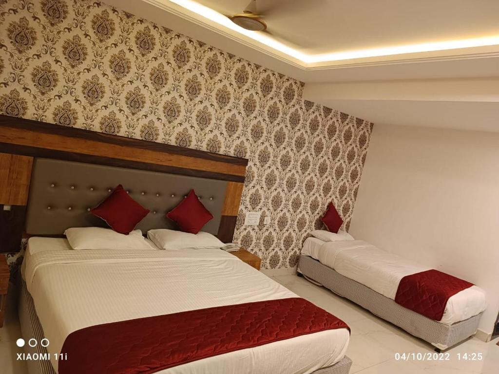 Postel nebo postele na pokoji v ubytování Hotel Woodside Prestige