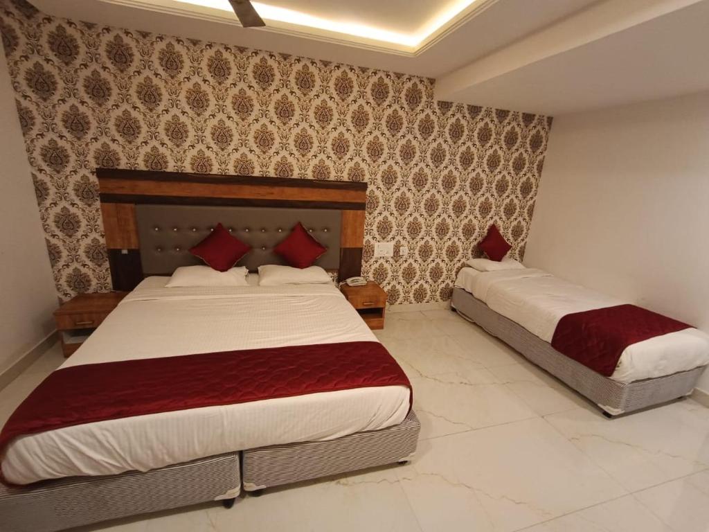 Postel nebo postele na pokoji v ubytování Hotel Woodside Prestige
