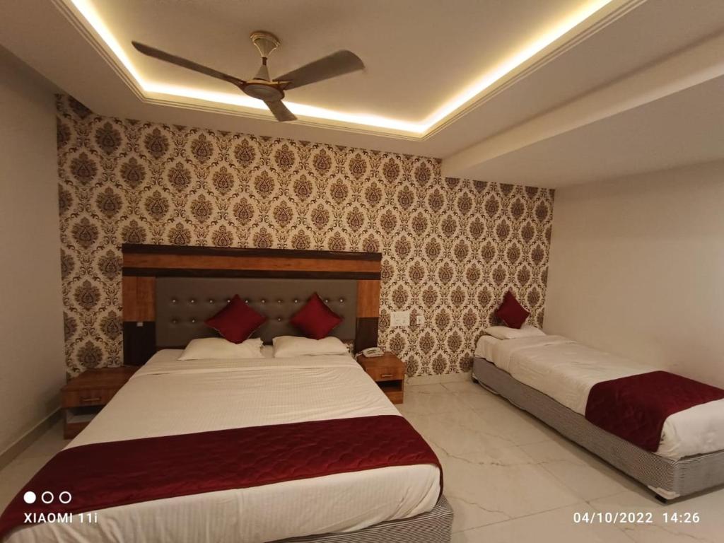 Postel nebo postele na pokoji v ubytování Hotel Woodside Prestige