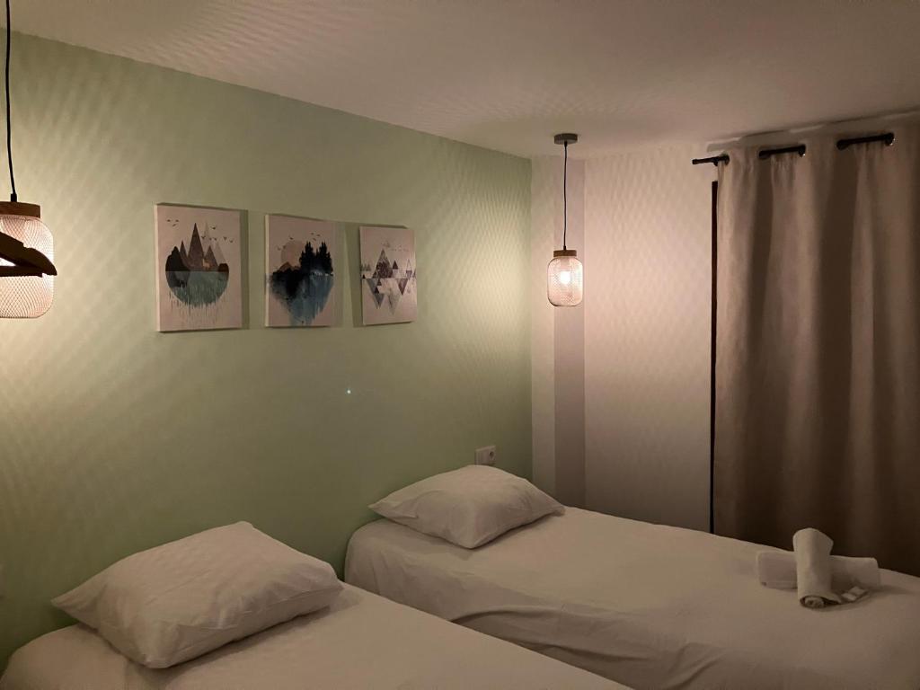 Postel nebo postele na pokoji v ubytování Les lofts M