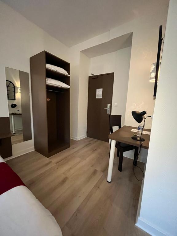 Postel nebo postele na pokoji v ubytování Hôtel Agena