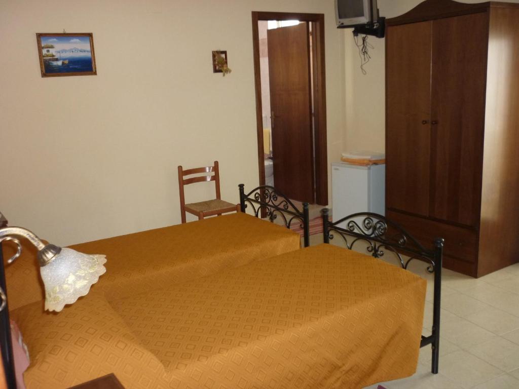 Postel nebo postele na pokoji v ubytování Albergo Vittoria