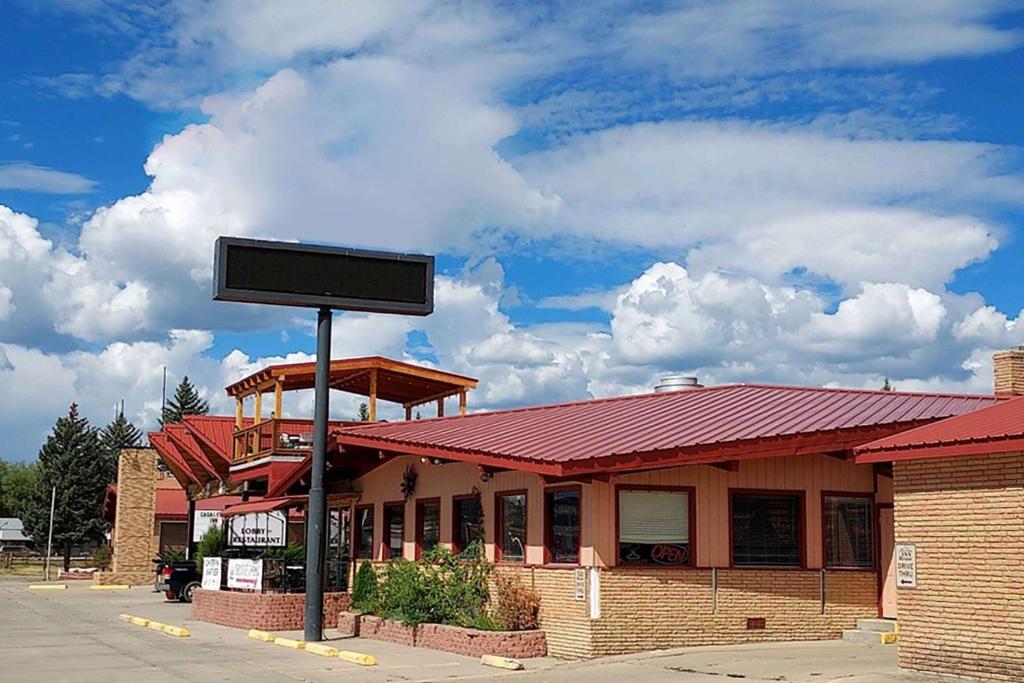 a building with a sign in front of it at Casa Lemus Inn in Raton