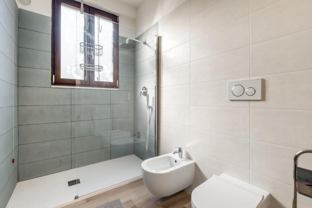 Kúpeľňa v ubytovaní Scuole CEMM San Vito Apartment with parking
