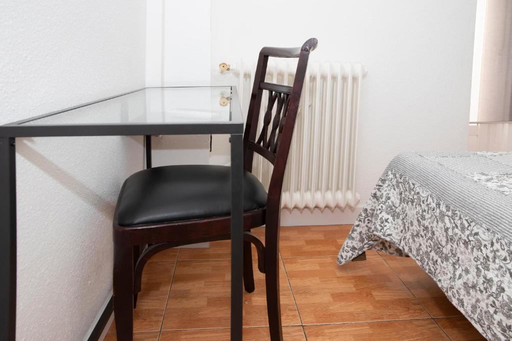 Postel nebo postele na pokoji v ubytování Hostal Tokio
