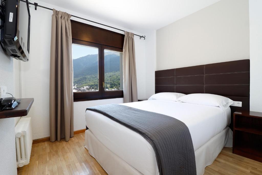 Postel nebo postele na pokoji v ubytování Hotel Blu Aran