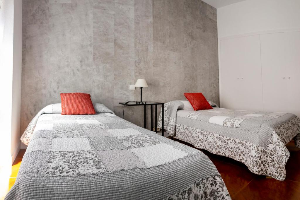 Postel nebo postele na pokoji v ubytování Hostal Tokio