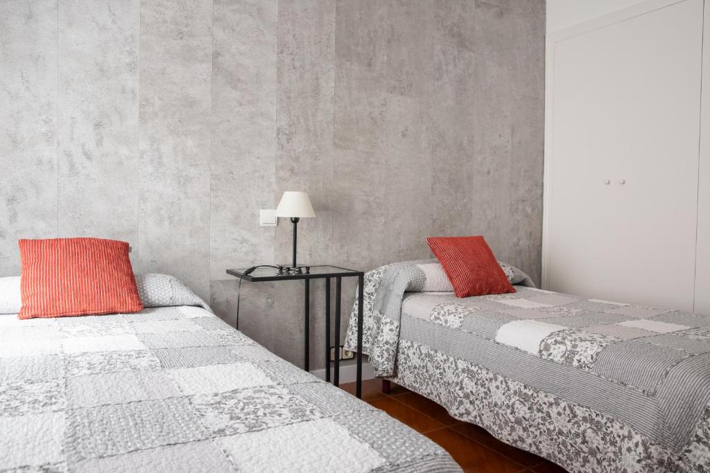 Postel nebo postele na pokoji v ubytování Hostal Tokio