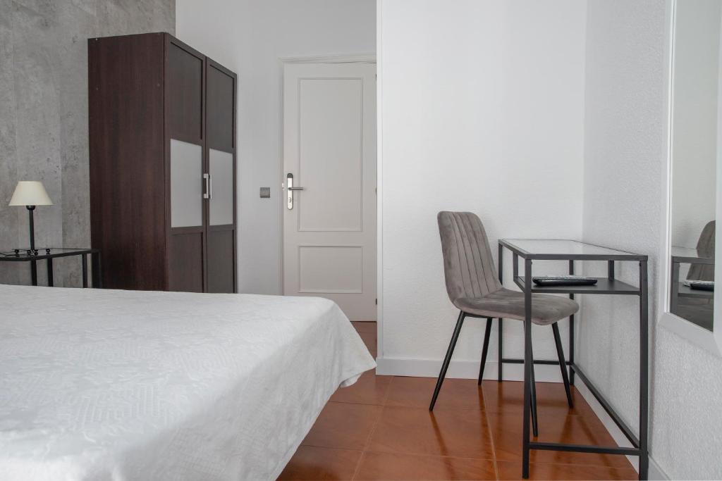 Postel nebo postele na pokoji v ubytování Hostal Tokio