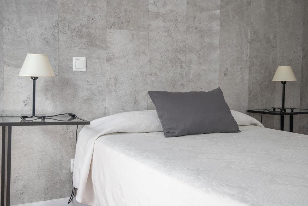 Postel nebo postele na pokoji v ubytování Hostal Tokio