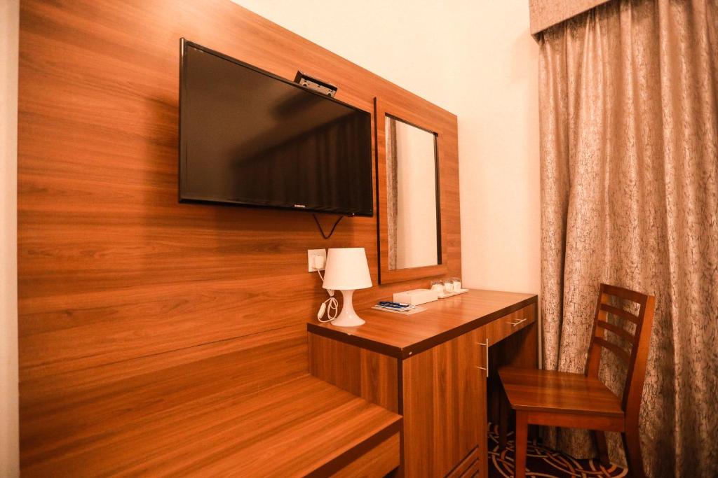 TV a/nebo společenská místnost v ubytování AL KARNAK HOTEL - BRANCH