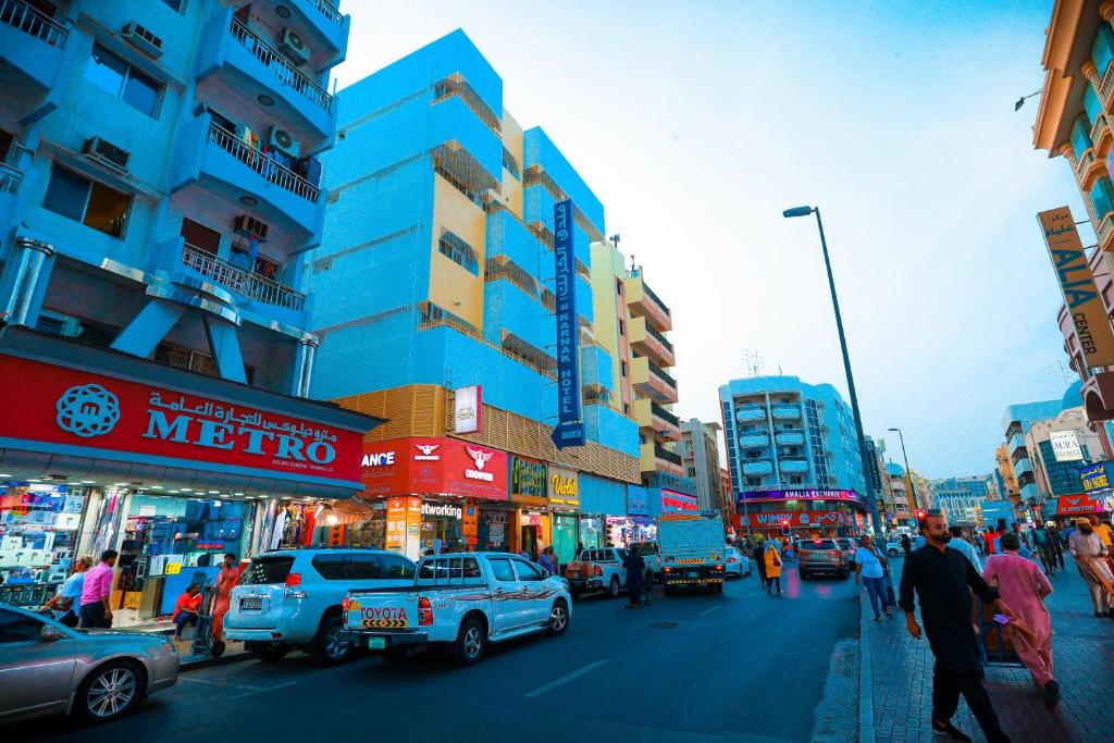 a busy city street with cars and people and buildings at AL KARNAK HOTEL - BRANCH in Dubai