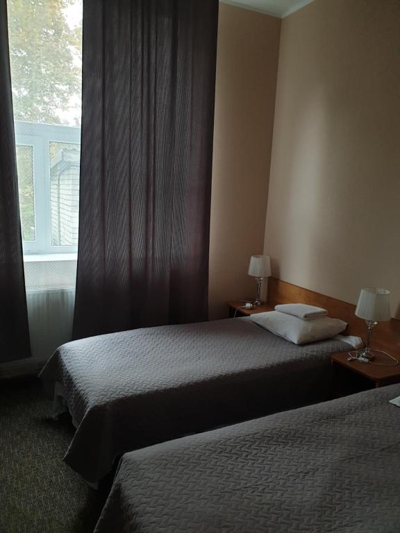 Postel nebo postele na pokoji v ubytování Hotel Yes