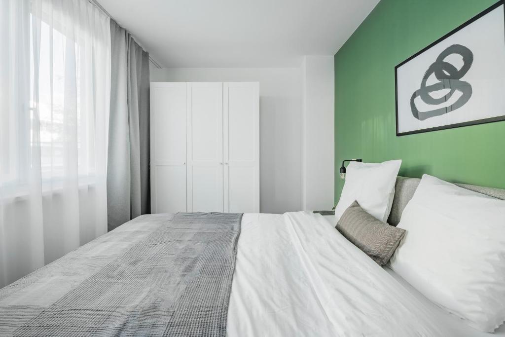 Łóżko lub łóżka w pokoju w obiekcie Arbio I Liv's Place Lux Apartments