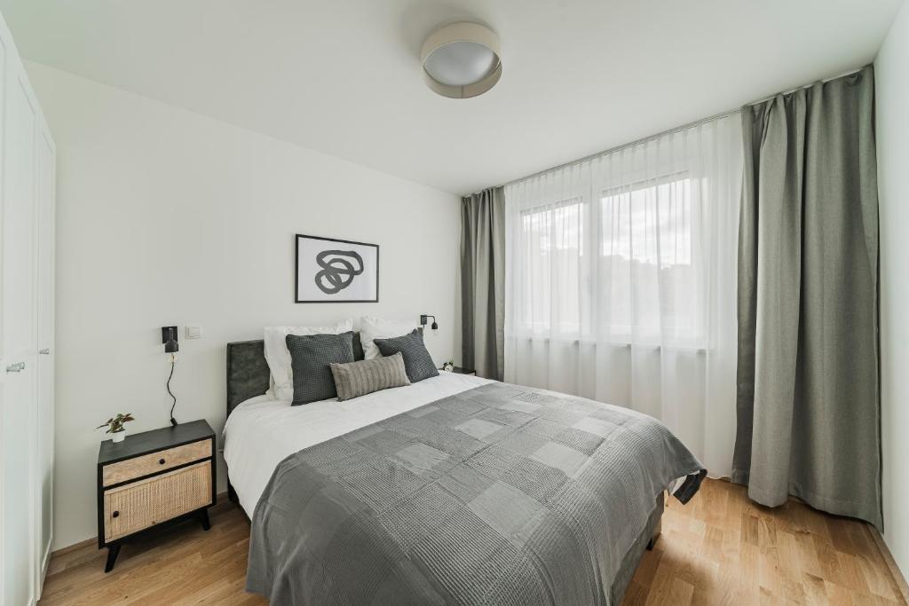 Łóżko lub łóżka w pokoju w obiekcie Arbio I Liv's Place Lux Apartments