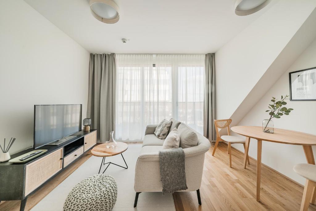 Telewizja i/lub zestaw kina domowego w obiekcie Arbio I Liv's Place Lux Apartments