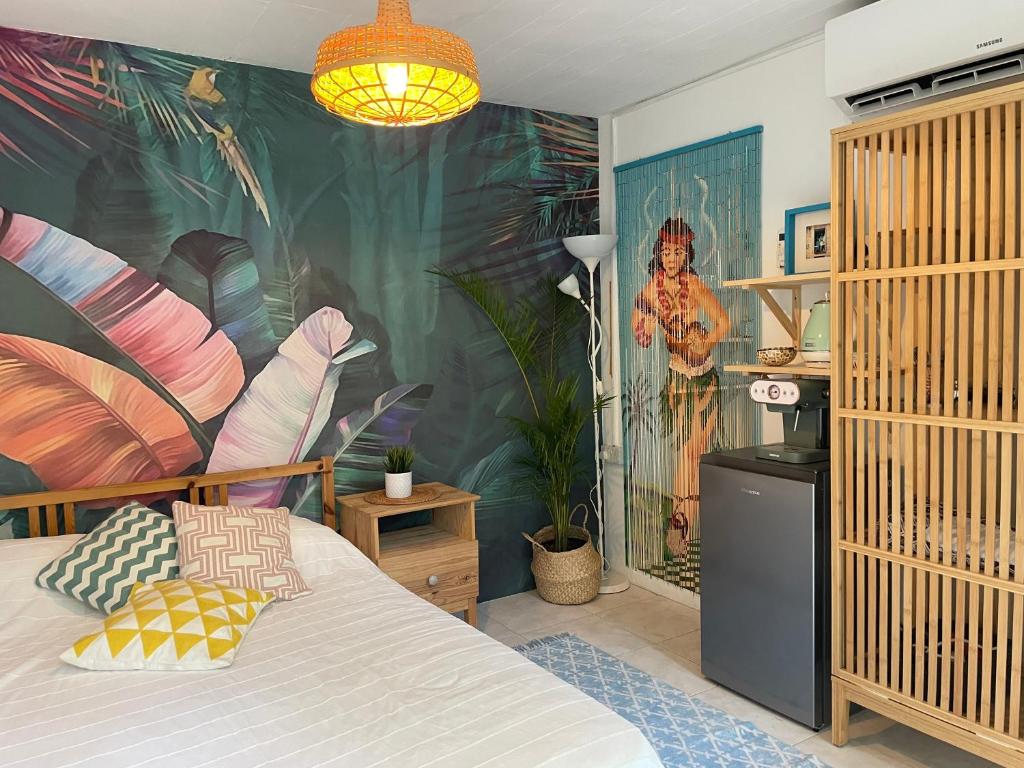 a bedroom with a bed with a painting on the wall at Tropicana Guestroom 7 min walk from the beach in Dubai